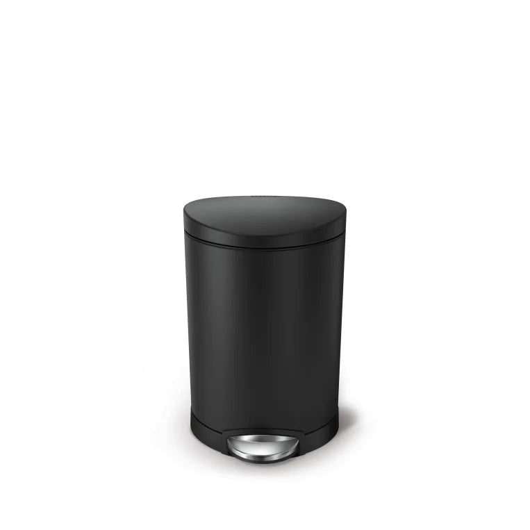 Black trash bin with a silver pedal on a white background
